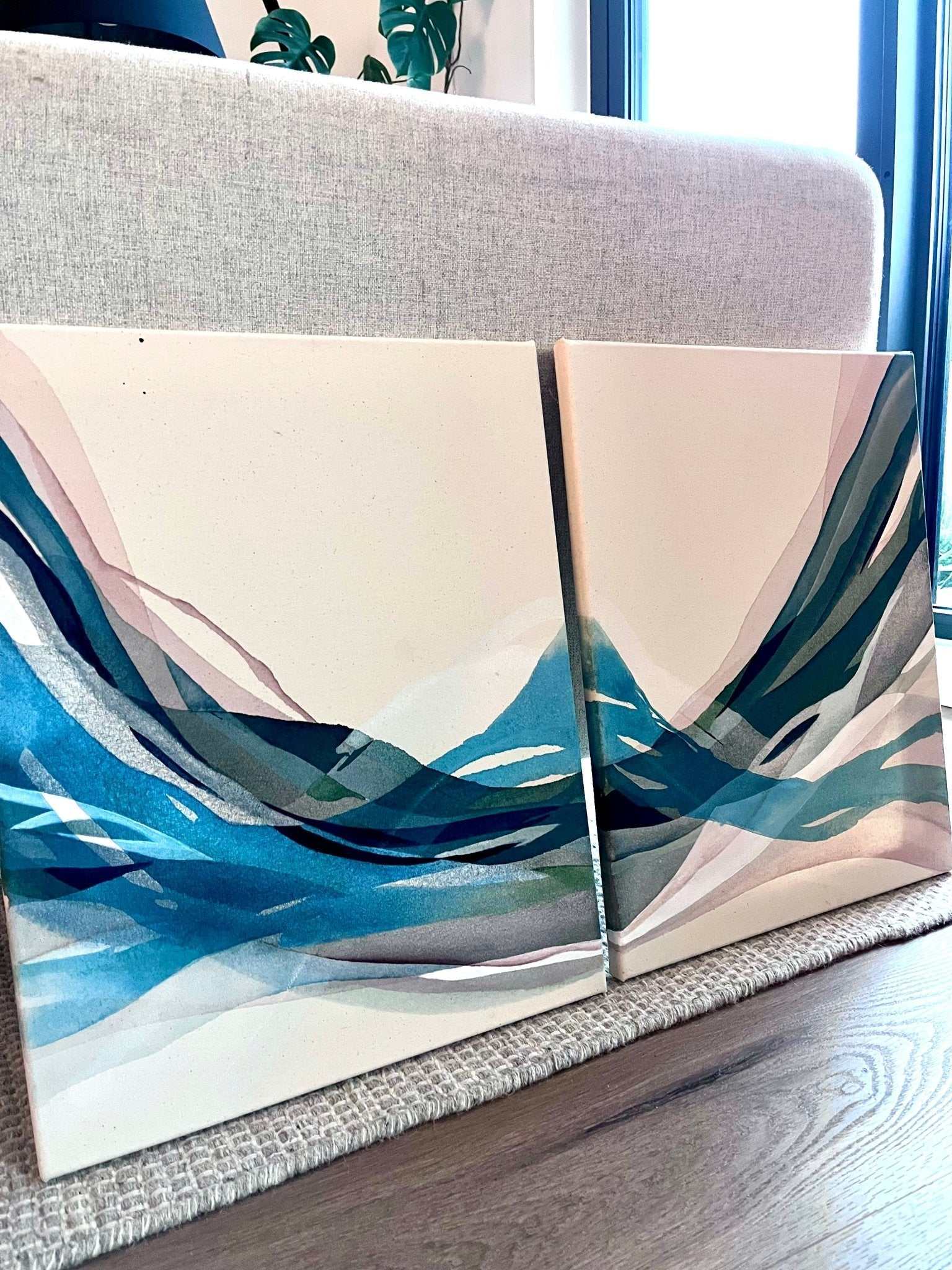 Diptych acrylic painting showing fluid, organic forms with earthy and cool tones on cotton canvas, 40x50 cm each, titled "Along the way I found you (I & II)."